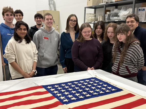 Kyle Haddad-Fonda with students looking at MOHAI collections