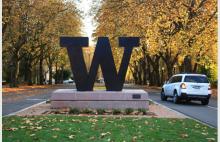 W at the entrance of campus