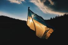 The Ukrainian flag waves as the sun rises 