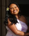 Aliyah Adelita Siva with purple Samoan tribal dress and flower in hair.