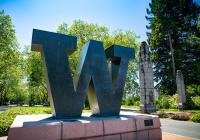 W at the north entrance to campus