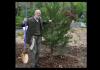 Richard Johnson planting a tree